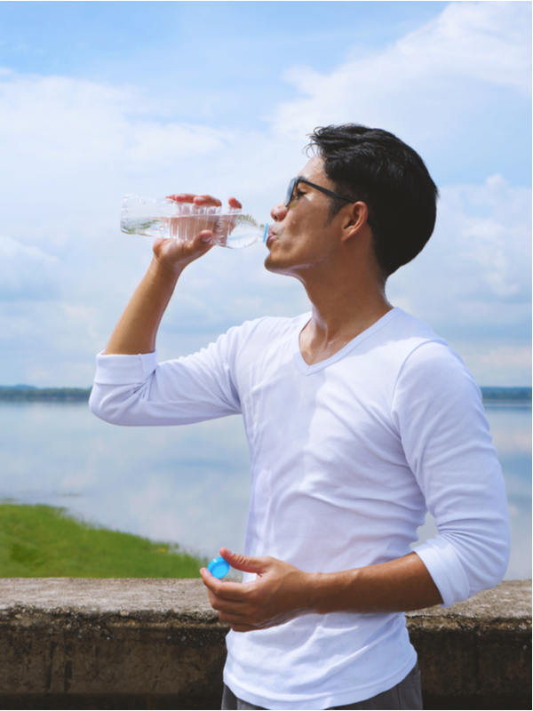  Young man taking a water break from outdoor training